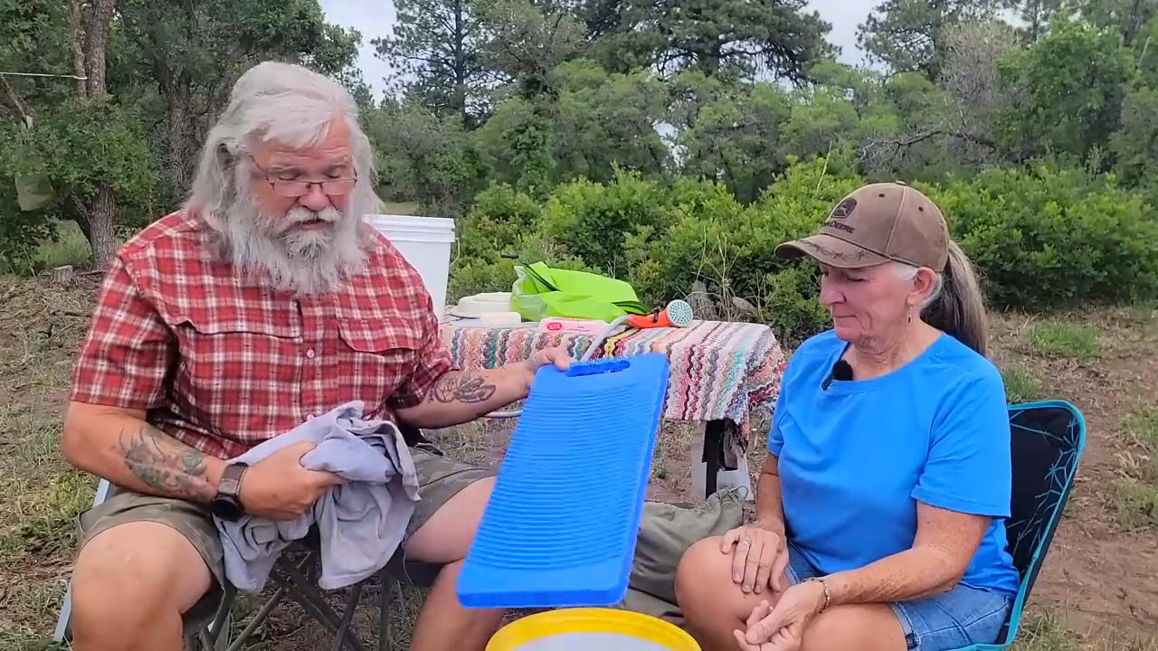 Make a camp washing machine using bucket and plunger