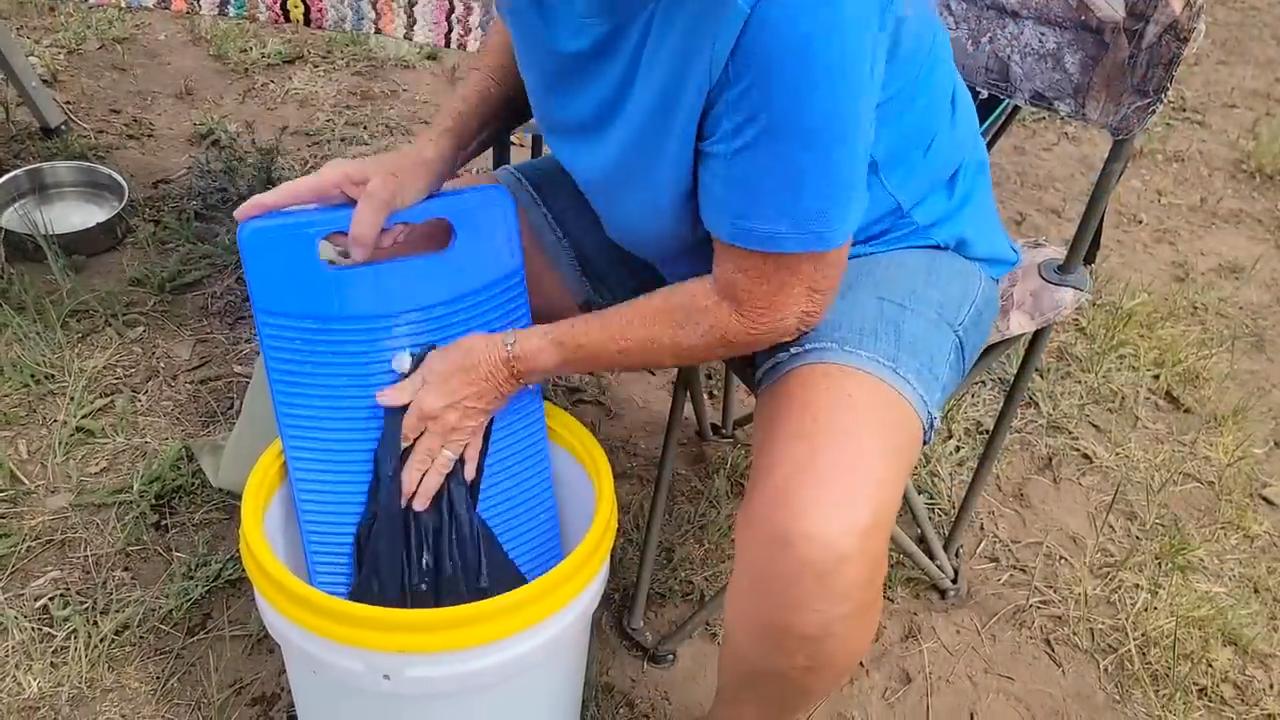 Hand Washing Laundry in a Bucket